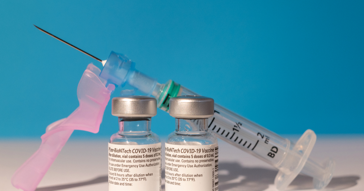 MADRID, SPAIN - 2021/02/09: In this photo illustration two vials of Pfizer - BioNTech COVID-19 vaccine for coronavirus treatment and a syringe. The Pfizer and BioNTech coronavirus vaccine is effective against South African and British variants of the virus, according to a study published in the journal Natural Medicine that indicated that the vaccine generates antibodies that neutralize mutated versions of the virus that first appeared in UK and South Africa. (Photo Illustration by Marcos del Mazo/LightRocket via Getty Images)